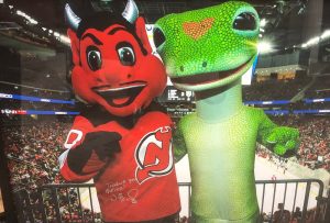 Sports Celebrity Endorsements The GEICO Gecko with the New Jersey Devils mascot